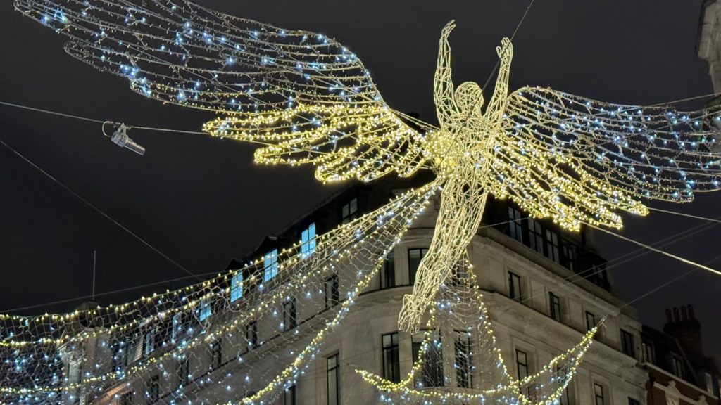 London's Christmas Lights: Regent Street - a winged angel above the traffic