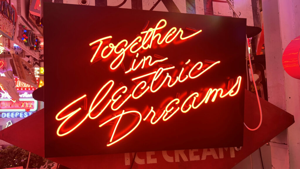 A red neon sign saying Together in Electric Dreams at God's Own Junkyard - a museum dedicated to neon signs.