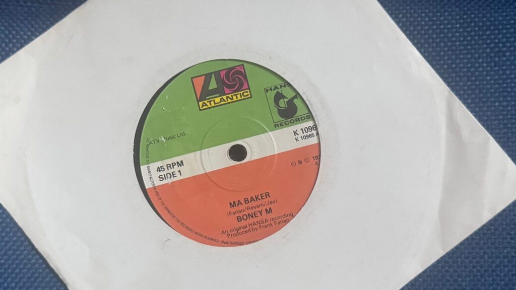 7-inch vinyl single of Boney M’s “Ma Baker” on Atlantic/Hansa Records, photographed in a white paper sleeve.